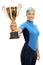 Joyful female swimmer holding a gold trophy