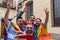 Joyful Gay Friends Capture Pride, Smiles, and Friendship in Colorful Selfie at Doorstep