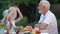 Joyful girl fantasizing with grandpa and looking in sky, carefree childhood