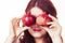 Joyful girl playing with pomegranate fruits