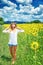 Joyful girl in sunflowers field