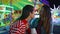 Joyful girls talking sharing secrets at luna amusement park. Happy best friends