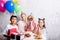 Joyful group of happy children standing near the table