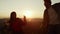 Joyful guy and girl jumping in air outdoor. Man and woman dancing in mountains