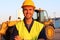 Joyful handsome labourer at work