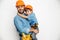 Joyful handyman embracing with son stock photo