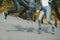 Joyful happy family jump on country road in autumn. Closeup