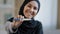 Joyful islamic young woman in hijab smiling happily holding pregnancy test excited pregnant lady surprised and happy