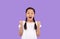 Joyful Korean Girl Shaking Fists Over Purple Background, Studio Shot