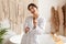 Joyful Lady Enjoying Haircare Routine Singing With Hairbrush In Bathroom