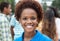 Joyful laughing african american woman with group of friends