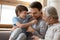 Joyful laughing different generations carefree family having fun indoors.