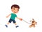 Joyful little boy is walking on a leash of a cute puppy. The concept of friendship with pets.