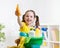 Joyful little girl cleanses a floor