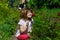 Joyful little girl sniff flowers