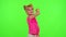 Joyful little kid girl blogger front of phone camera record video enjoy dance content on chroma key