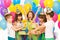 Joyful little kid girl receiving gifts at birthday