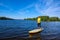 Joyful man paddling on a SUP board and enjoying life