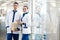 Joyful medical workers standing in modern clinic