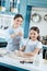 Joyful mom and daughter making cookies