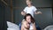 Joyful moments, young parents with son have fun together on bed at home in room