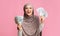 Joyful Muslim Lady Holding A Lot Of Money In Both Hands On Pink Background