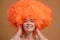 Joyful orange-haired woman.