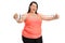 Joyful overweight woman exercising with a resistance band