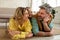 Joyful Parents And Daughter Embracing Posing Lying At Home