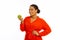 Joyful plump positive woman holding an apple