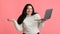 Joyful Plus Sized Girl Holding Laptop, Posing Over Pink Background