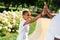 Joyful positive young boy giving high five