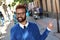 Joyful professional man dancing on the street