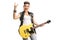 Joyful punk girl with an electric guitar making rock hand gesture