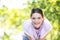 Joyful Radiance: Young Brunette Embracing Happiness in Sunlit Forest