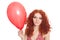 Joyful redhead girl holding balloon