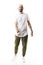 Joyful relaxed young bald stylish man dancing and moving wearing white t-shirt