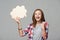 Joyful screaming teen girl holding thinking bubble