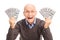 Joyful senior holding money in both hands