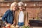 Joyful senior ladies cooking with enjoyment