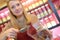 Joyful shop-assistant showing tea leaves in organic shop