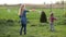 Joyful siblings playing with soap bubbles outdoors