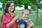 Joyful smiling mom & daughter & new pet kittens