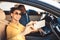 Joyful Spouses Making Selfie Sitting In Car Traveling On Vacation