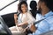 Joyful Spouses Putting On Seat Belts Sitting In New Automobile