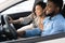 Joyful Spouses Testing New Car Sitting In Auto In Store