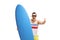 Joyful surfer with a surfboard making a thumb up sign