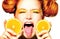 Joyful teen girl with juicy oranges. Freckles