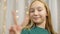 Joyful Teen Girl Portrait Close-up Posing front Camera. Girl Show V Gestures by Hand Sign Victory