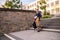 Joyful teenage boy descending the concrete stairs